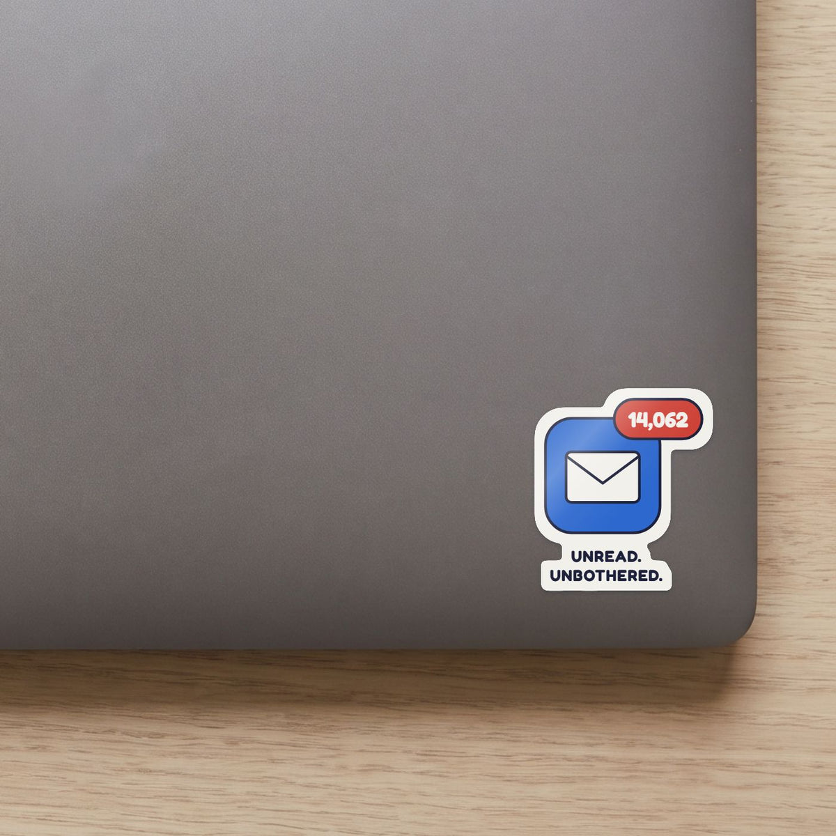 14,062 Unread sticker on the lid of a grey laptop