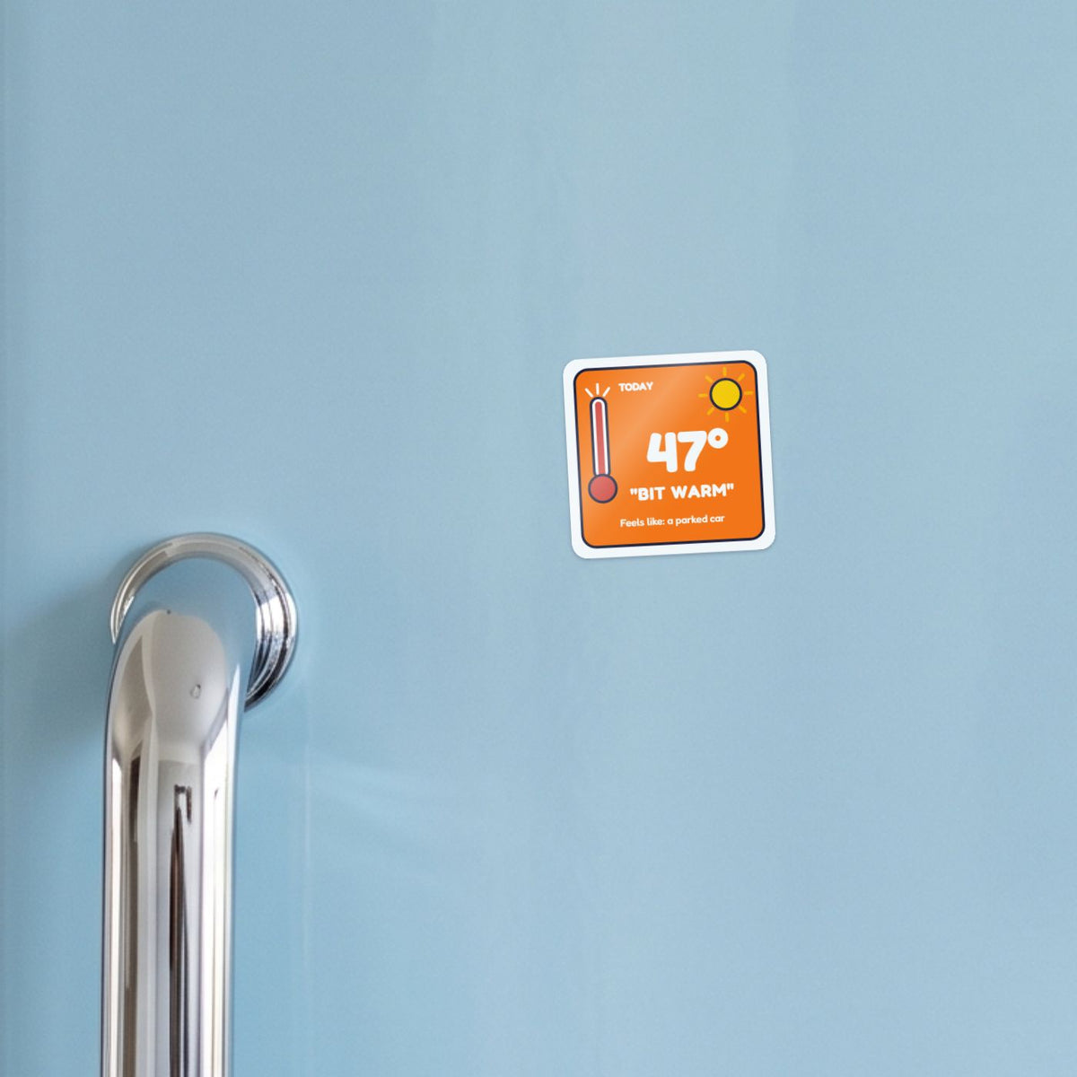 47 Degrees: Bit Warm sticker on a blue fridge door