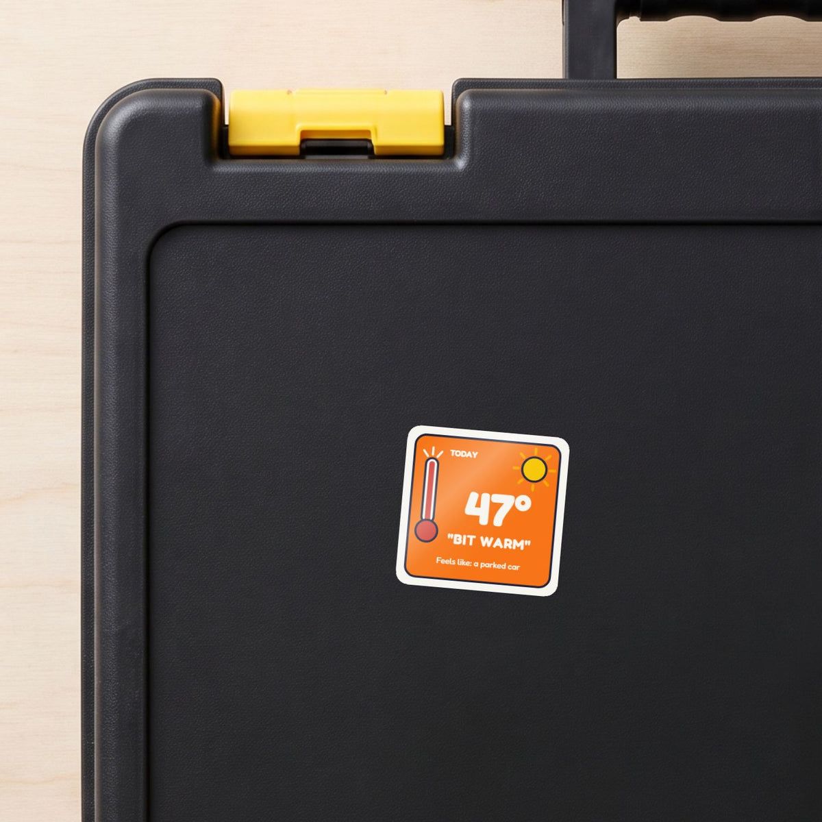 47 Degrees: Bit Warm sticker on a black toolbox