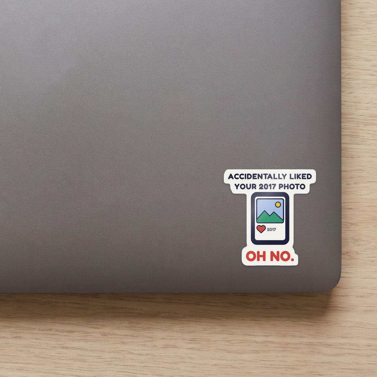 Accidentally Liked Your 2017 Photo sticker on the lid of a grey laptop