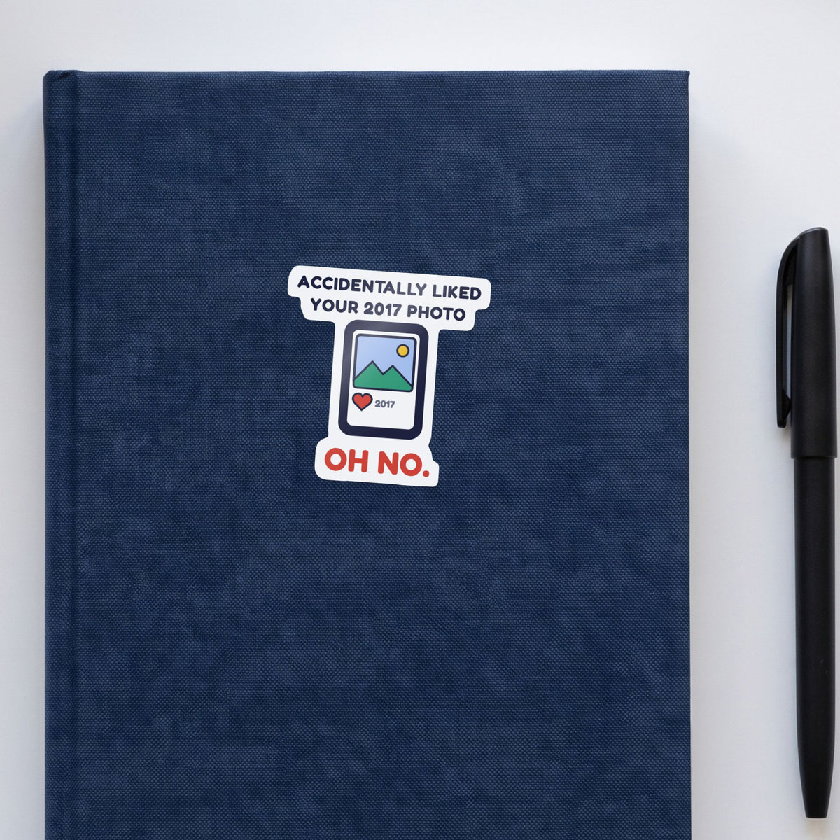 Accidentally Liked Your 2017 Photo sticker on a navy notebook