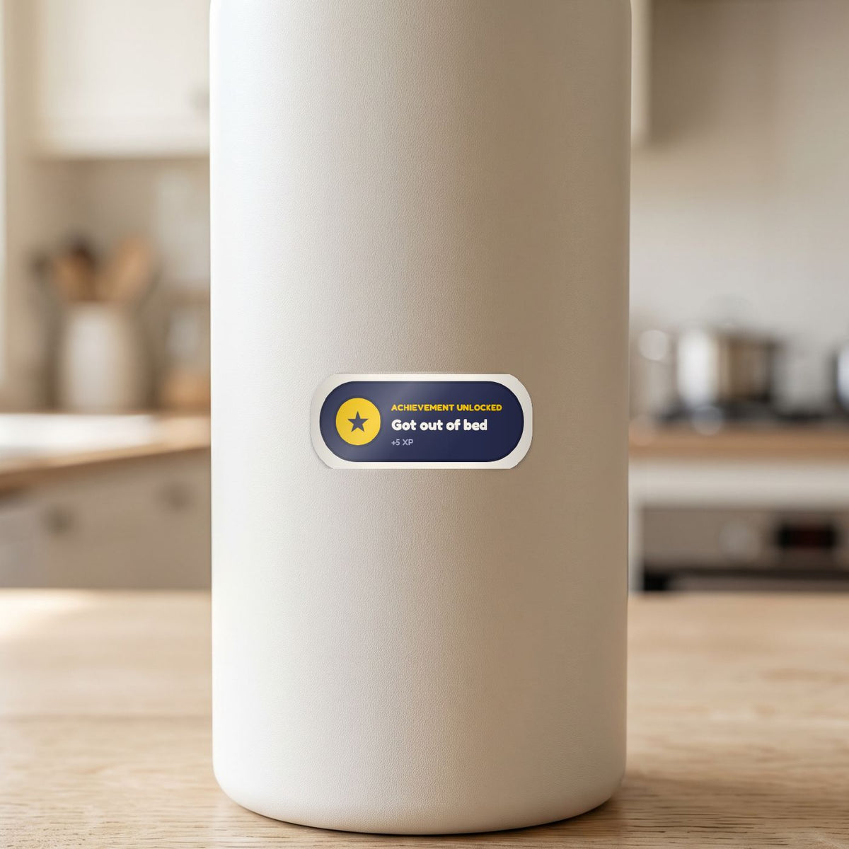 Achievement Unlocked: Got Out of Bed sticker on a white drink bottle