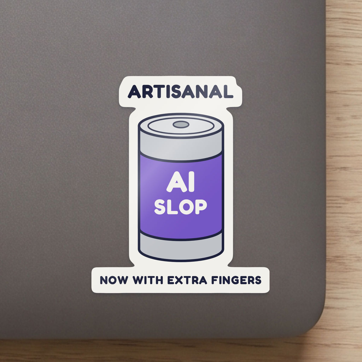 Artisanal AI Slop sticker close up on a laptop lid, showing the gloss and the white cut edge
