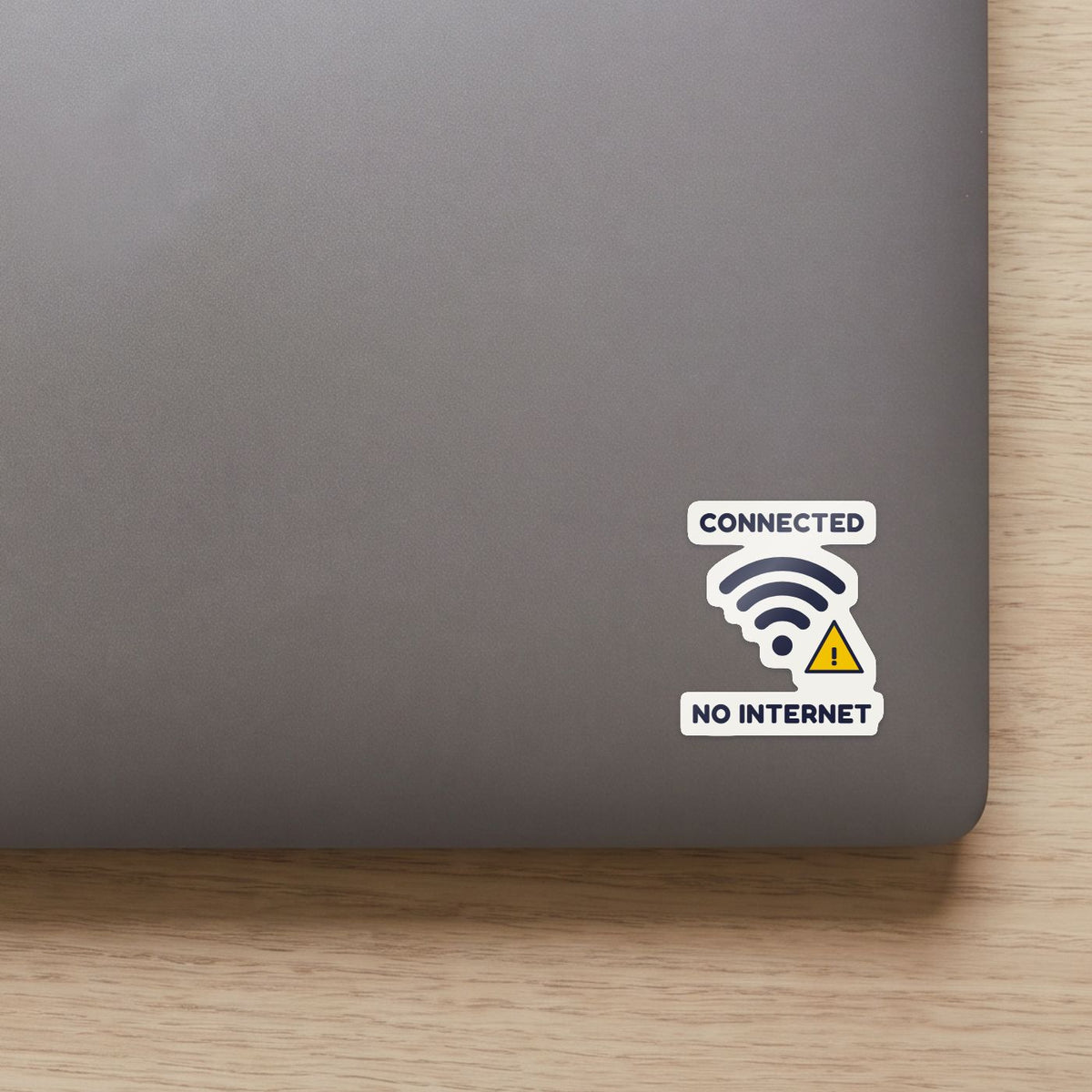 Connected, No Internet sticker on the lid of a grey laptop