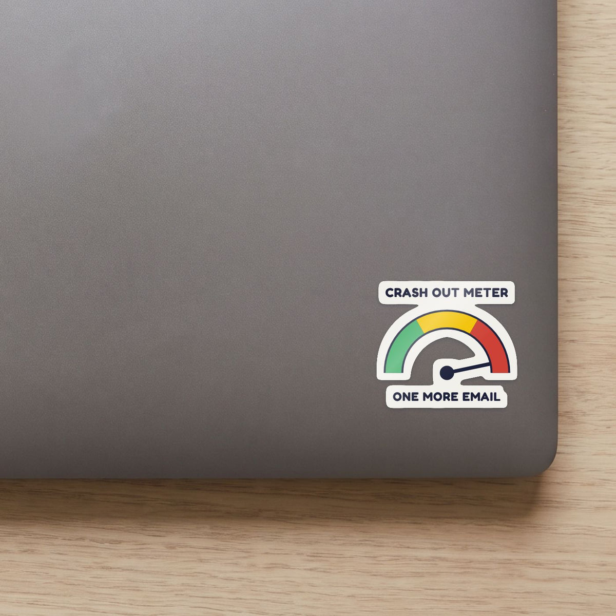 Crash Out Meter sticker on the lid of a grey laptop
