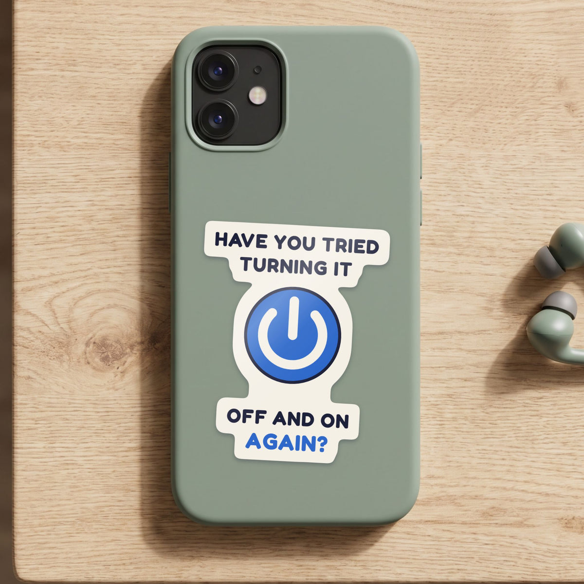 Have You Tried Turning It Off and On Again? sticker on a green phone case