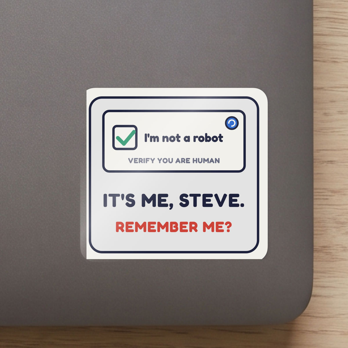 I'm Not a Robot. It's Me, Steve. sticker close up on a laptop lid, showing the gloss and the white cut edge