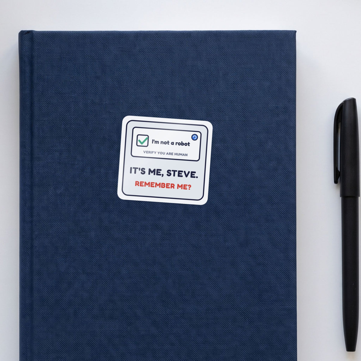 I'm Not a Robot. It's Me, Steve. sticker on a navy notebook
