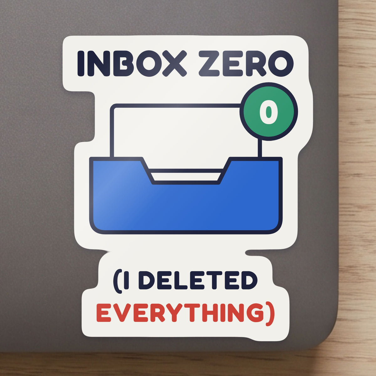Inbox Zero (I Deleted Everything) sticker close up on a laptop lid, showing the gloss and the white cut edge
