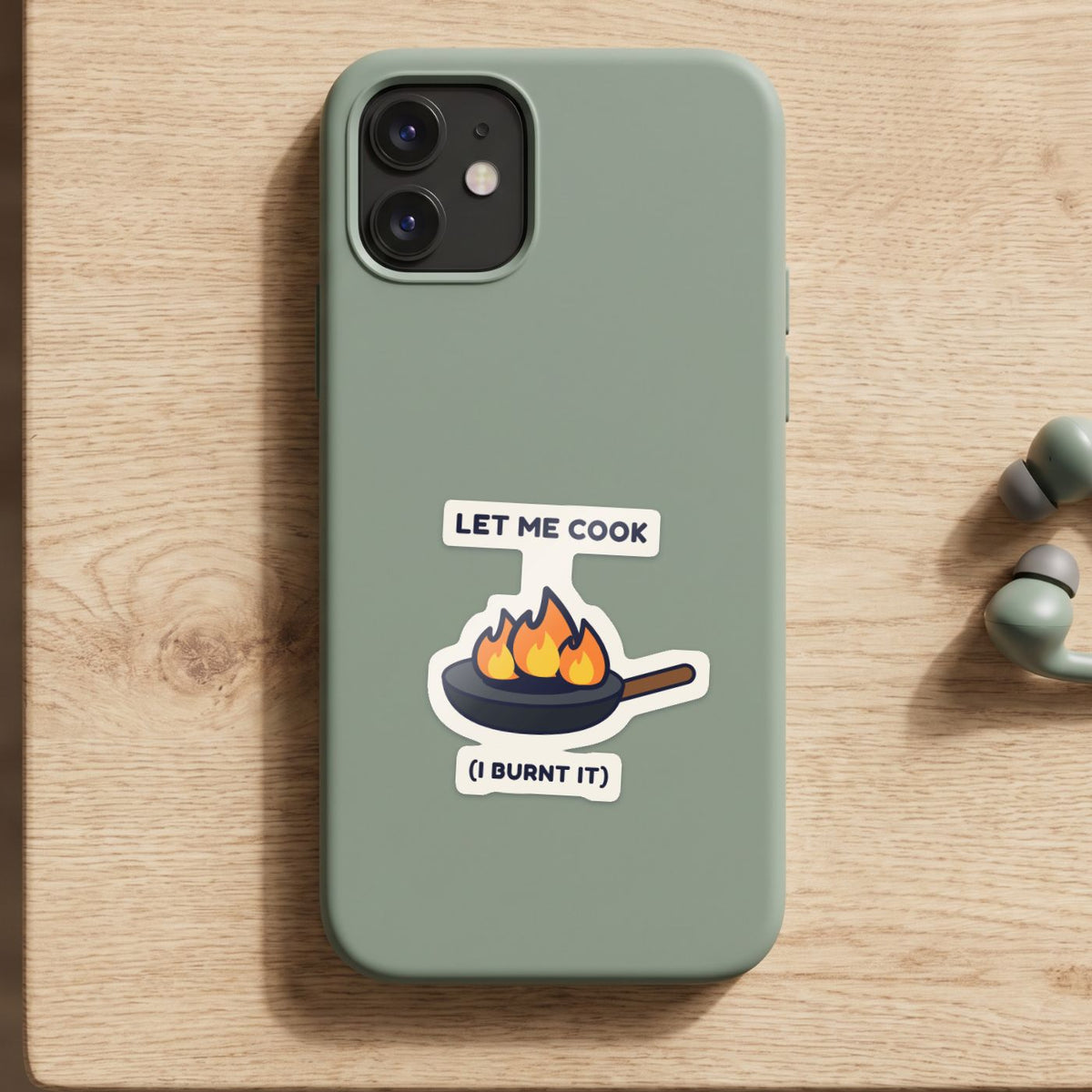 Let Me Cook sticker on a green phone case