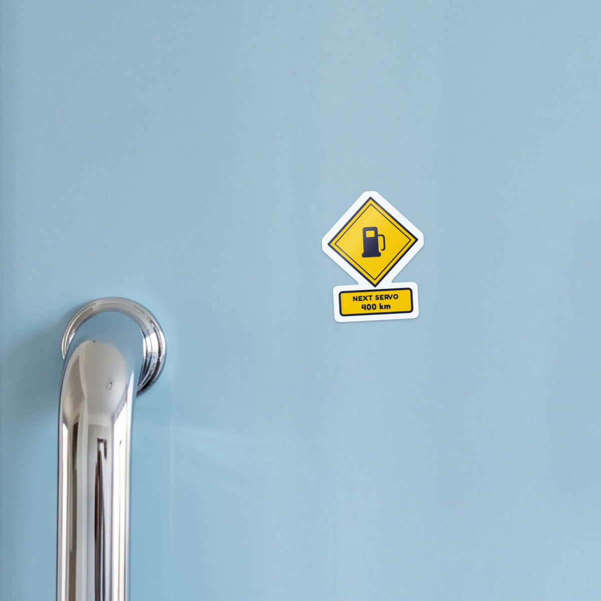 Next Servo 400 km sticker on a blue fridge door