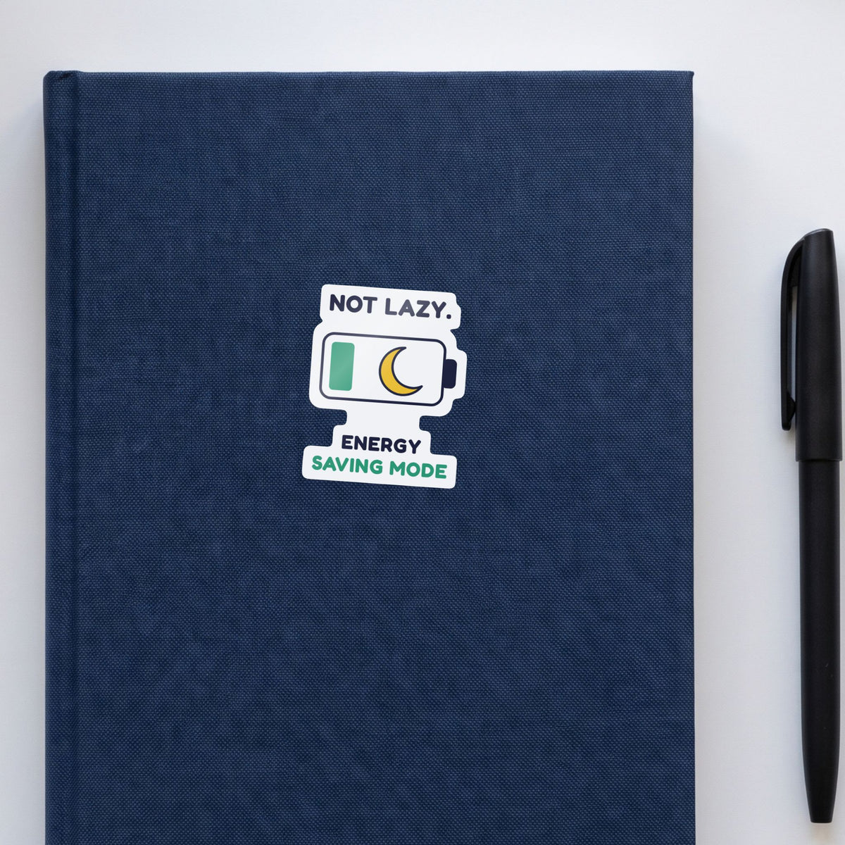 Not Lazy. Energy Saving Mode. sticker on a navy notebook