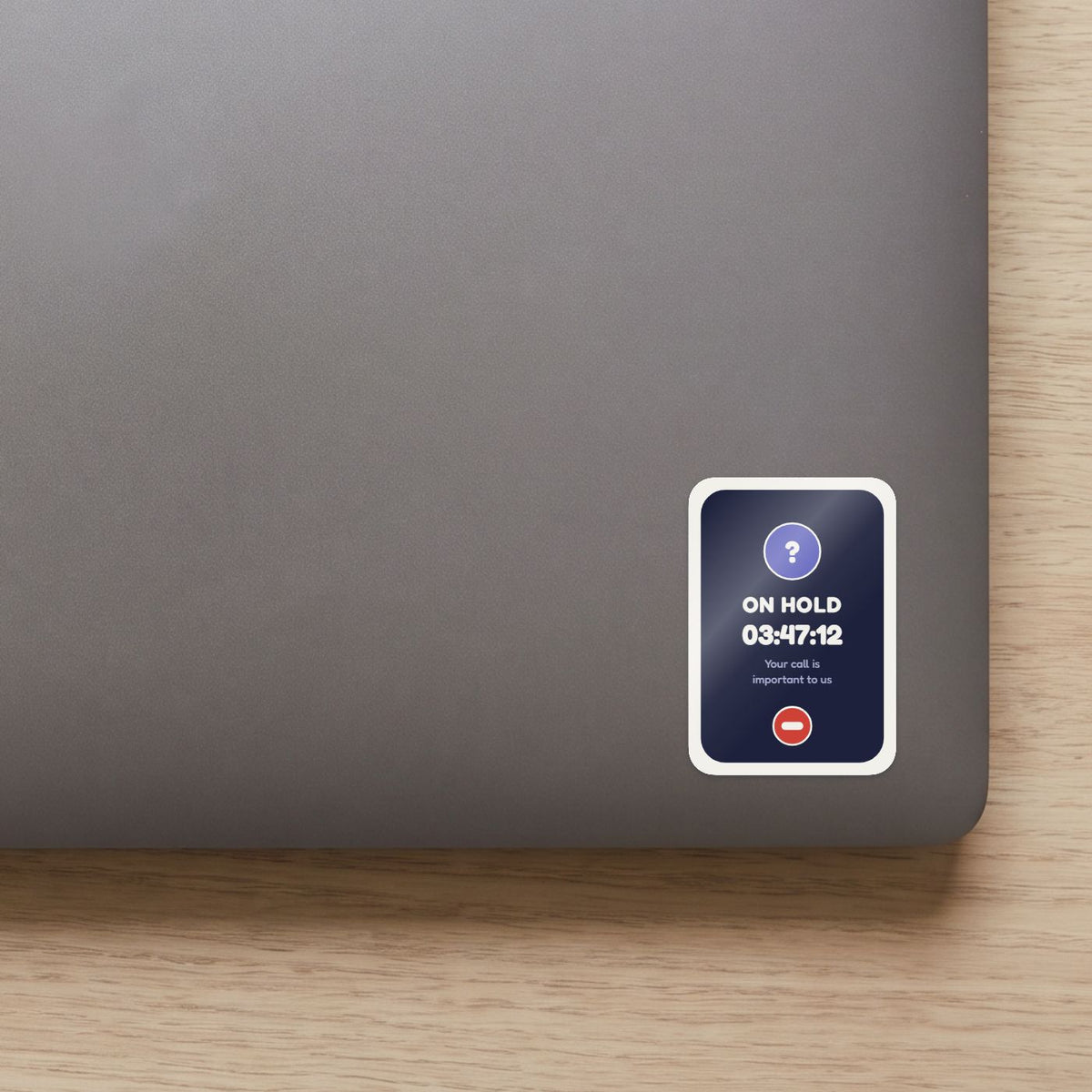 On Hold: 03:47:12 sticker on the lid of a grey laptop