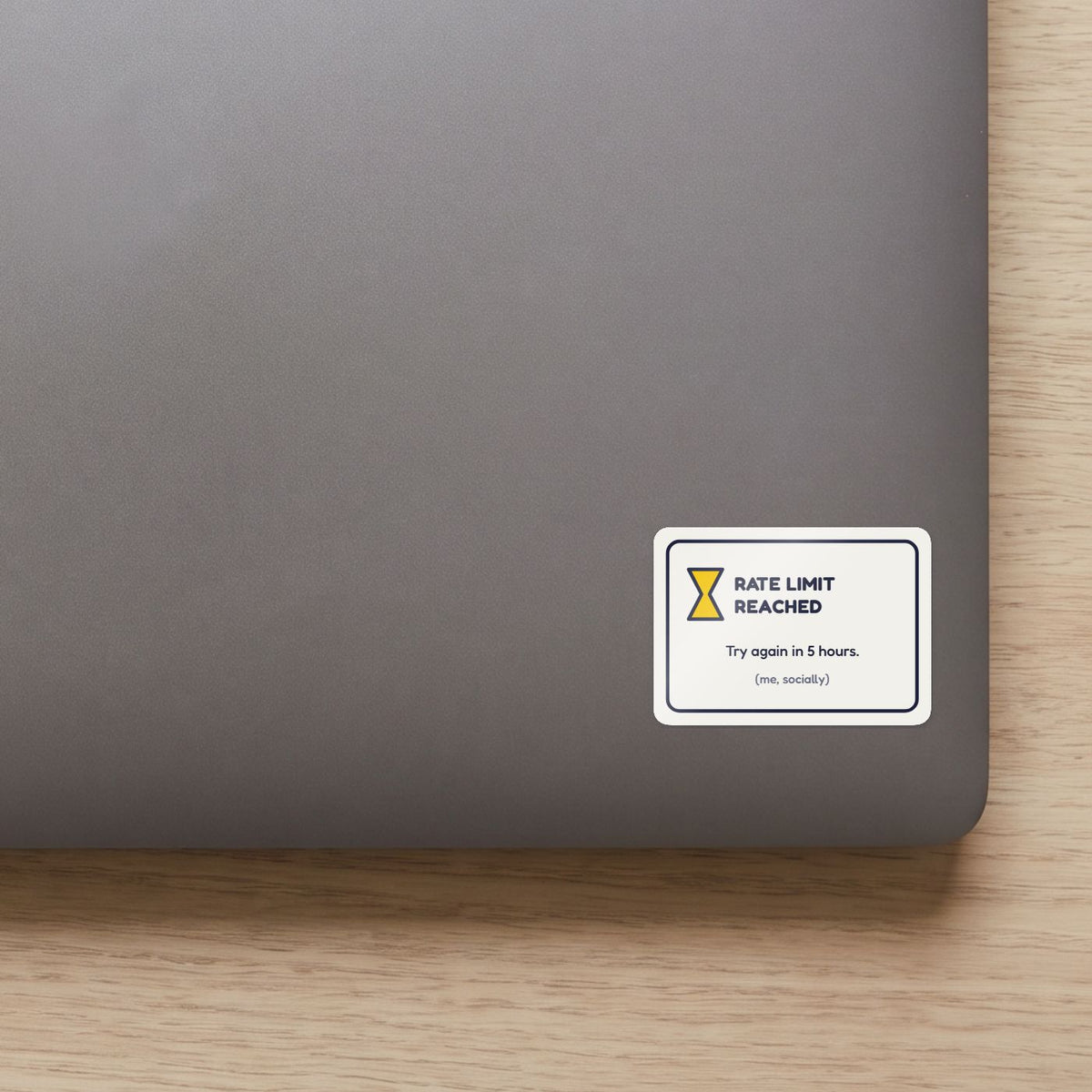 Rate Limit Reached sticker on the lid of a grey laptop