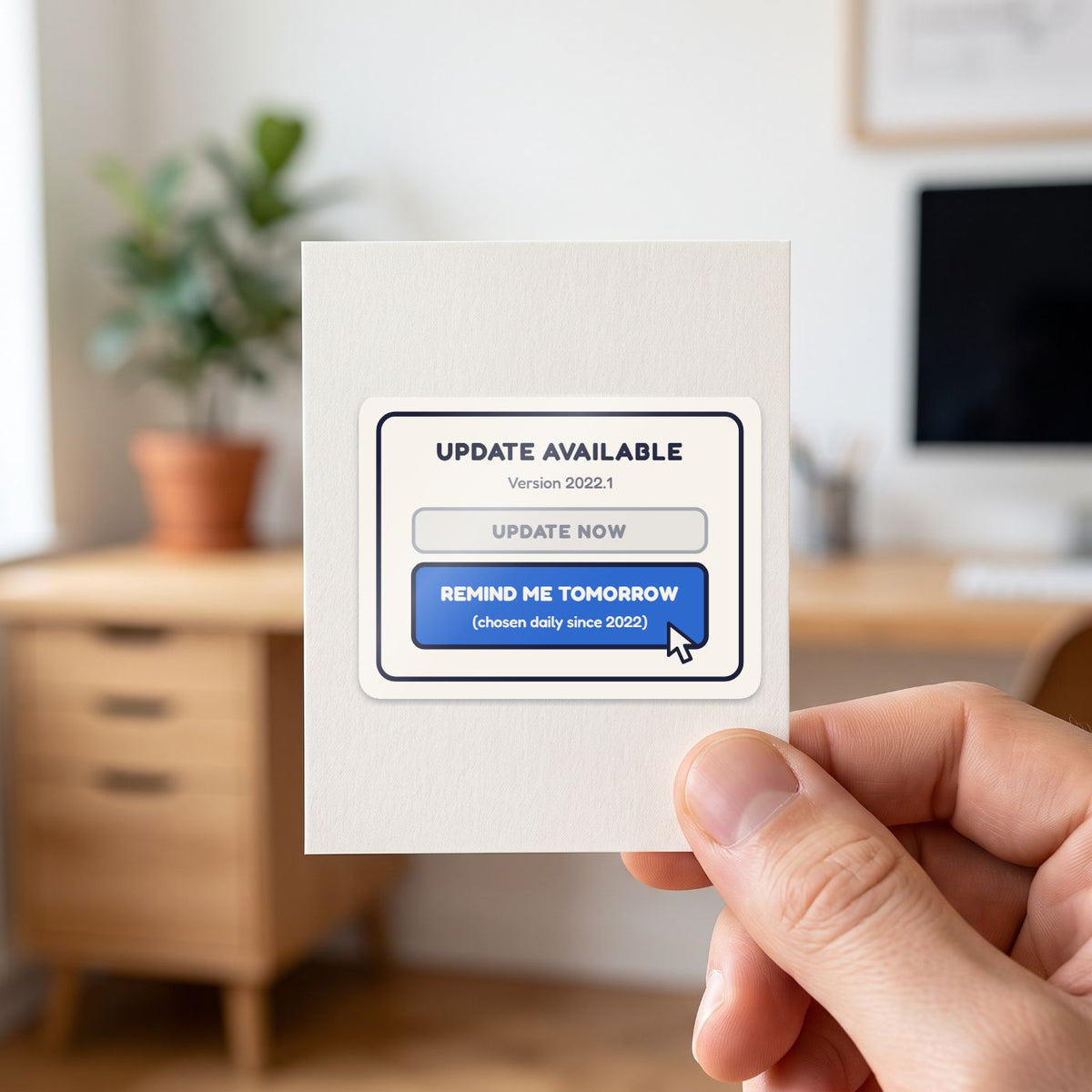 Remind Me Tomorrow sticker held in a hand on its white backing card