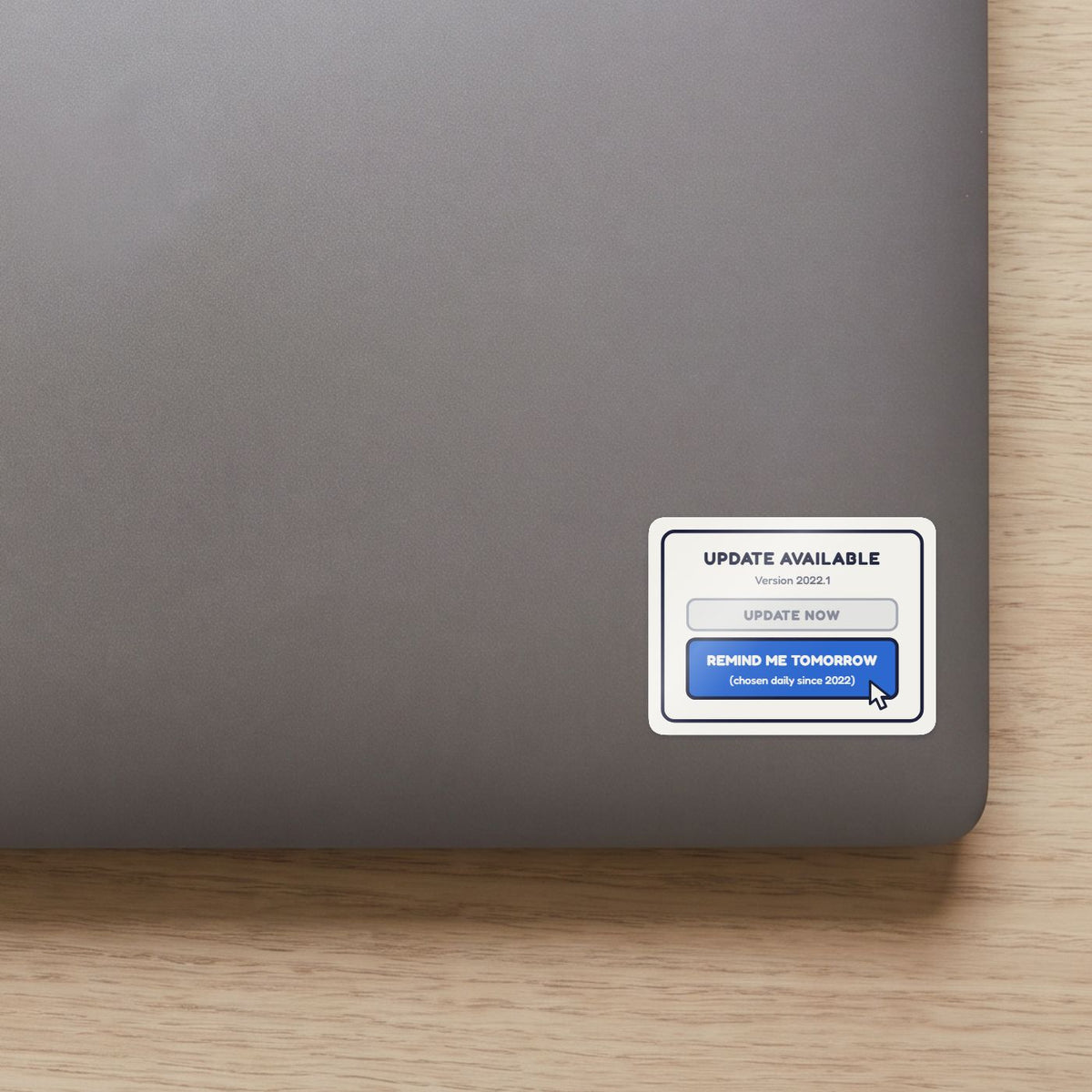 Remind Me Tomorrow sticker on the lid of a grey laptop