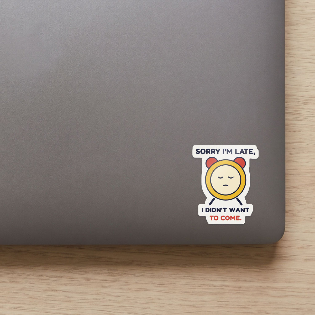 Sorry I'm Late, I Didn't Want to Come sticker on the lid of a grey laptop