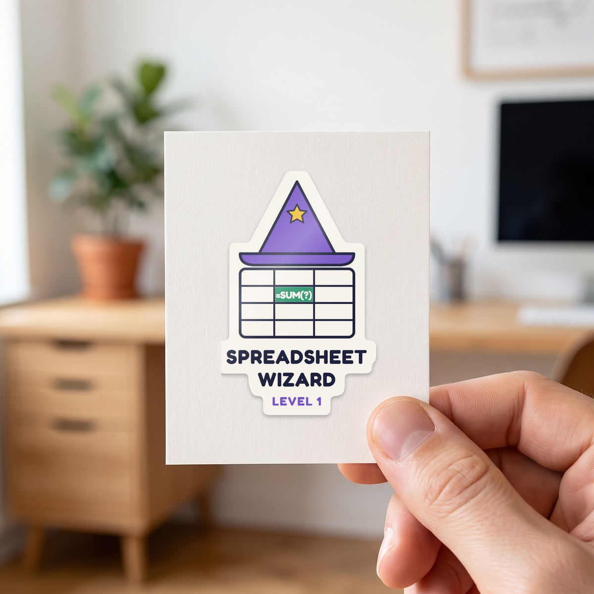 Spreadsheet Wizard, Level 1 sticker held in a hand on its white backing card