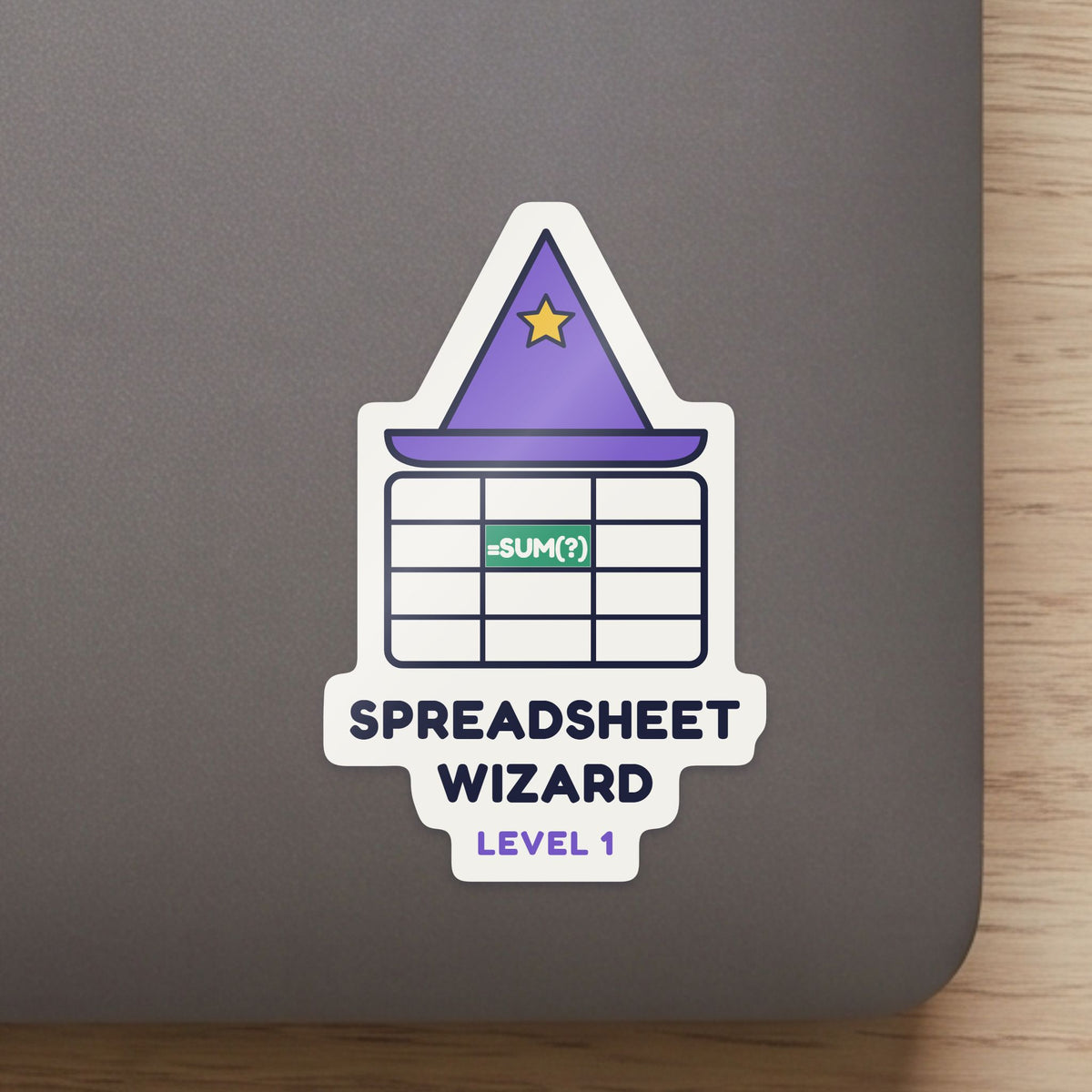 Spreadsheet Wizard, Level 1 sticker close up on a laptop lid, showing the gloss and the white cut edge