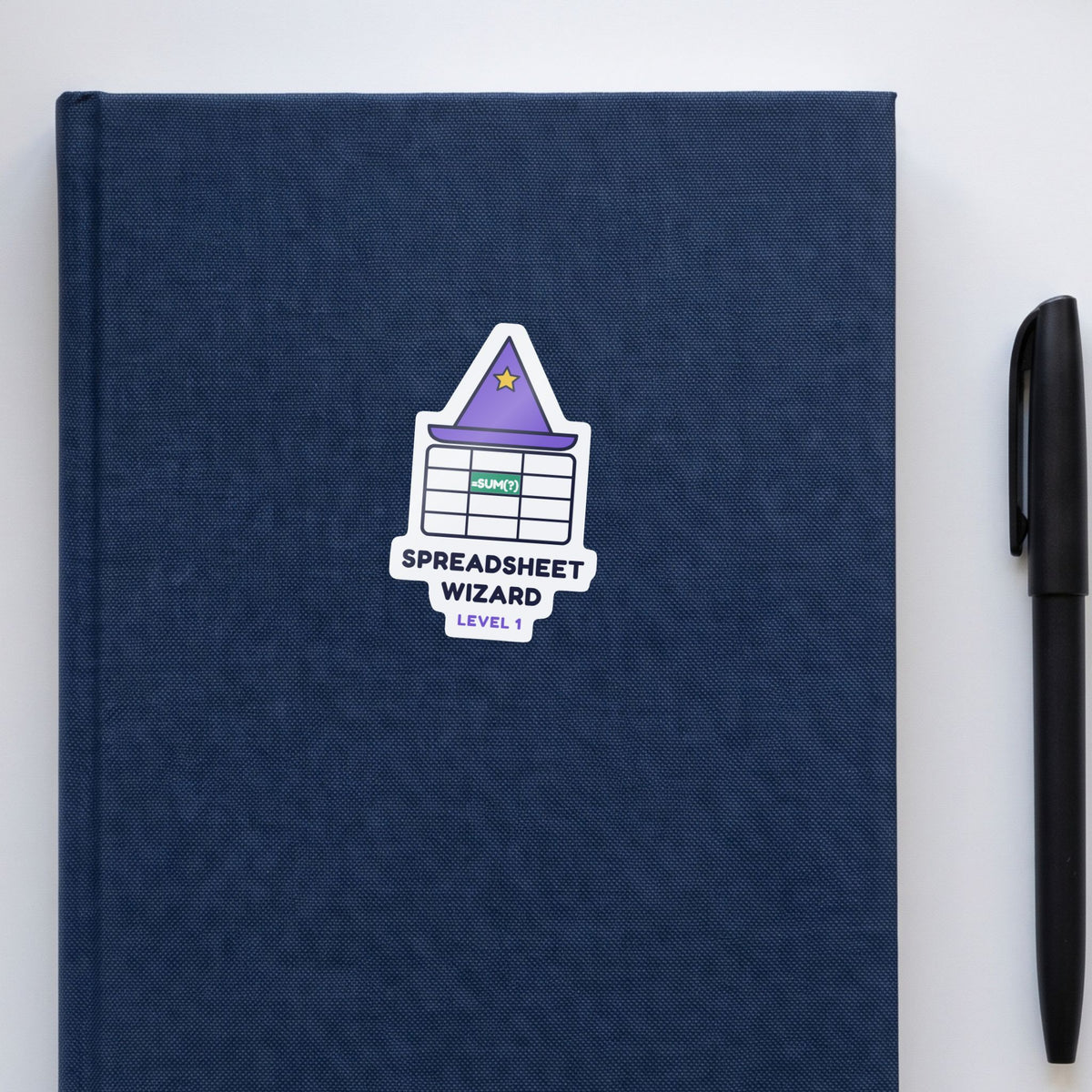 Spreadsheet Wizard, Level 1 sticker on a navy notebook