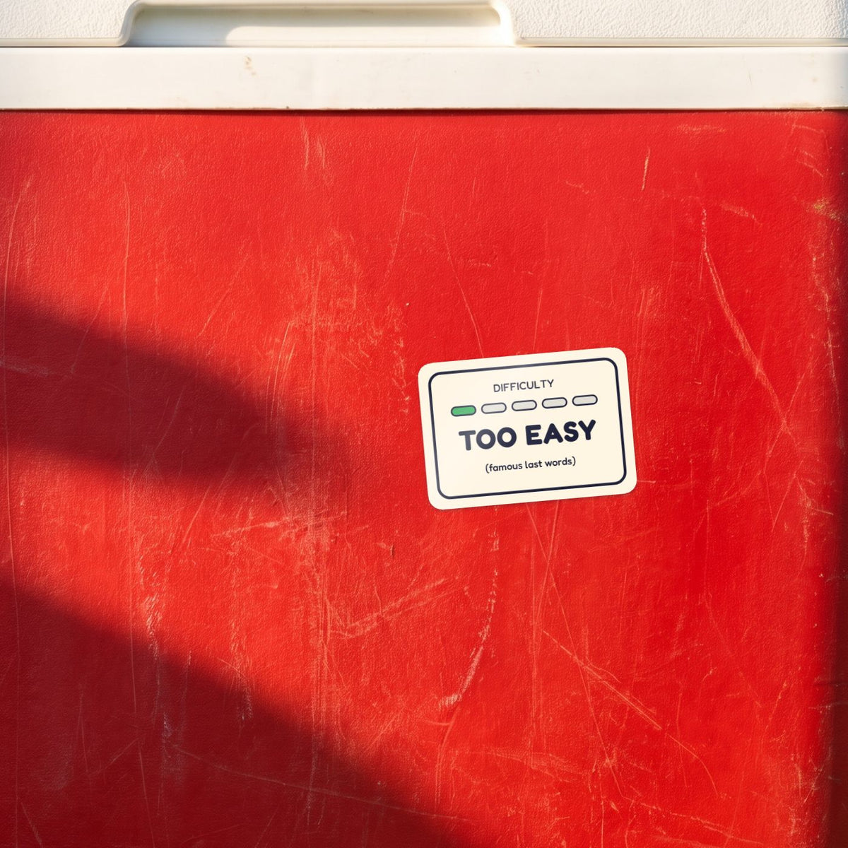 Too Easy sticker on a red esky