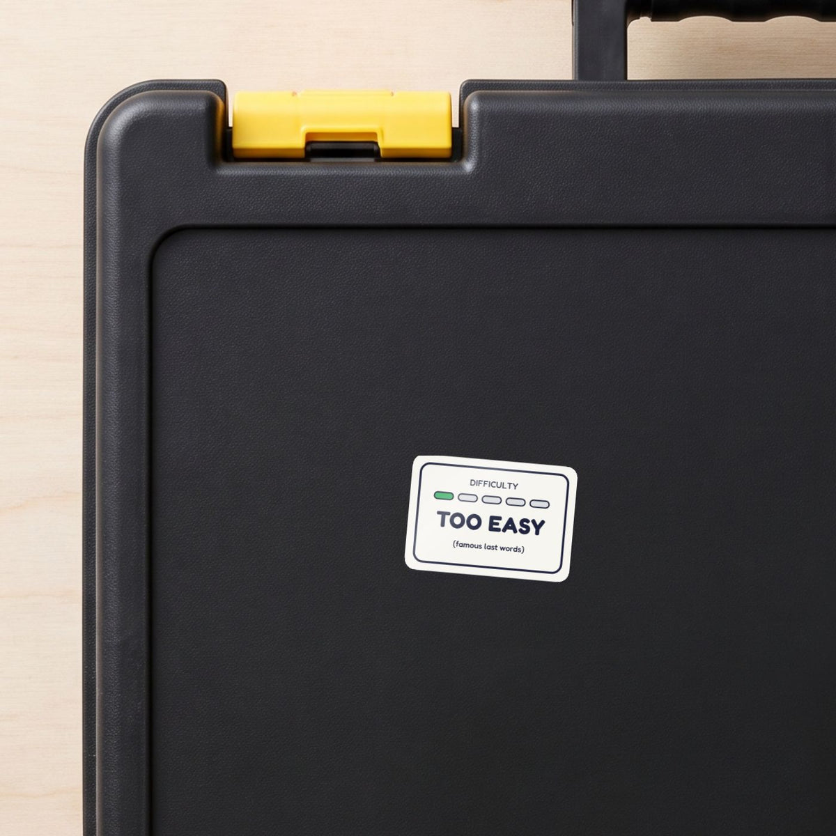 Too Easy sticker on a black toolbox