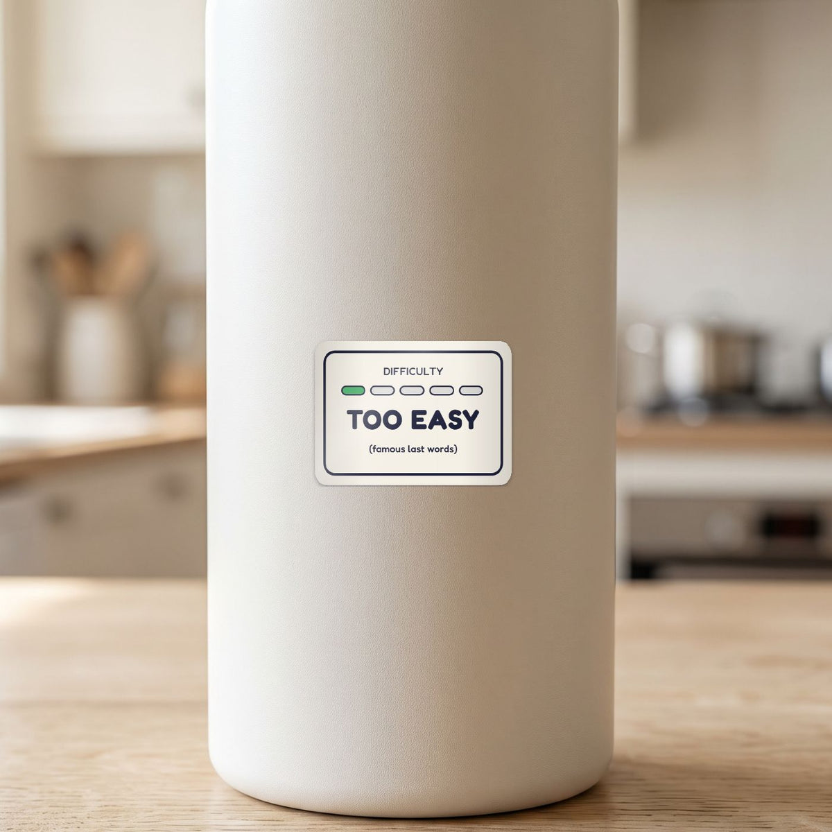 Too Easy sticker on a white drink bottle