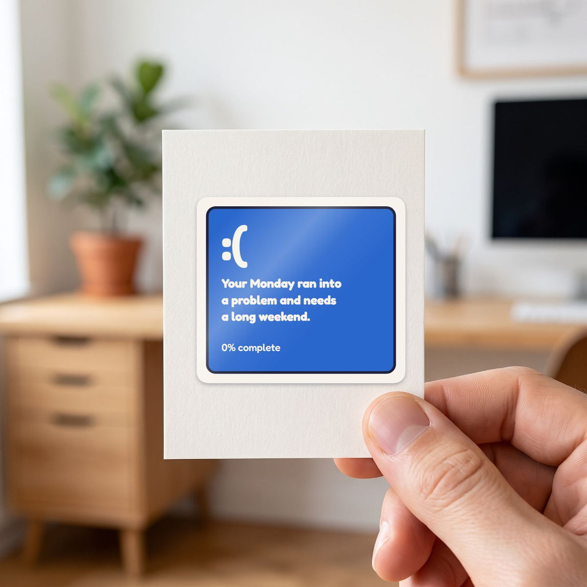 Your Monday Ran Into a Problem sticker held in a hand on its white backing card