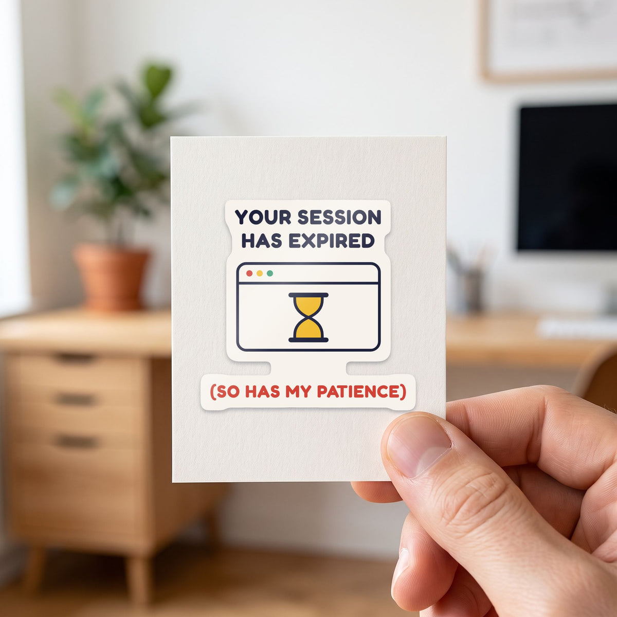 Your Session Has Expired sticker held in a hand on its white backing card